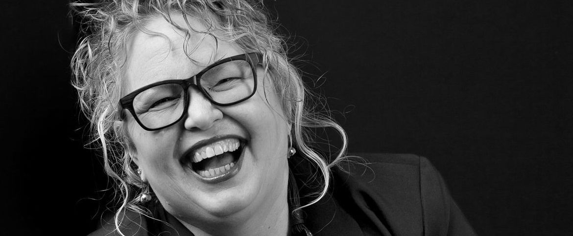 2024-Kelly-BW-laughing-w-glasses-EDIT