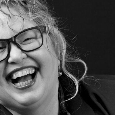 2024-Kelly-BW-laughing-w-glasses-EDIT