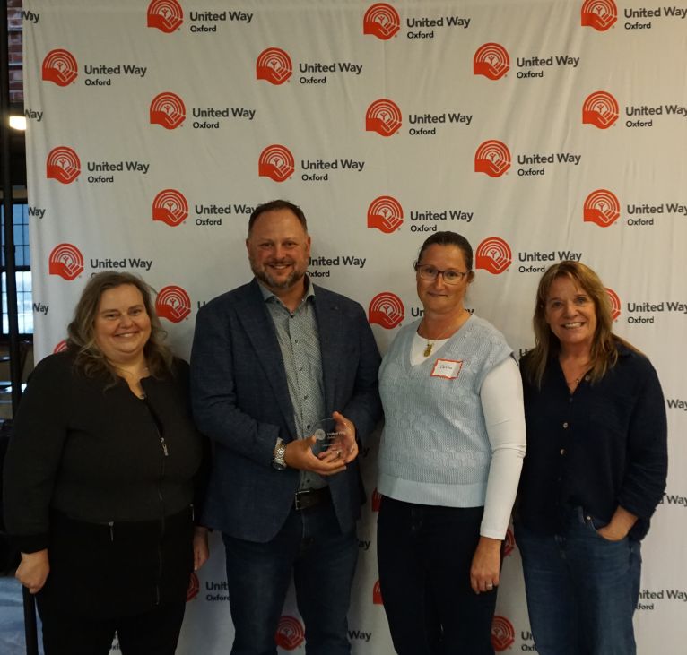 Owner of Adams Building Supply accepting his award